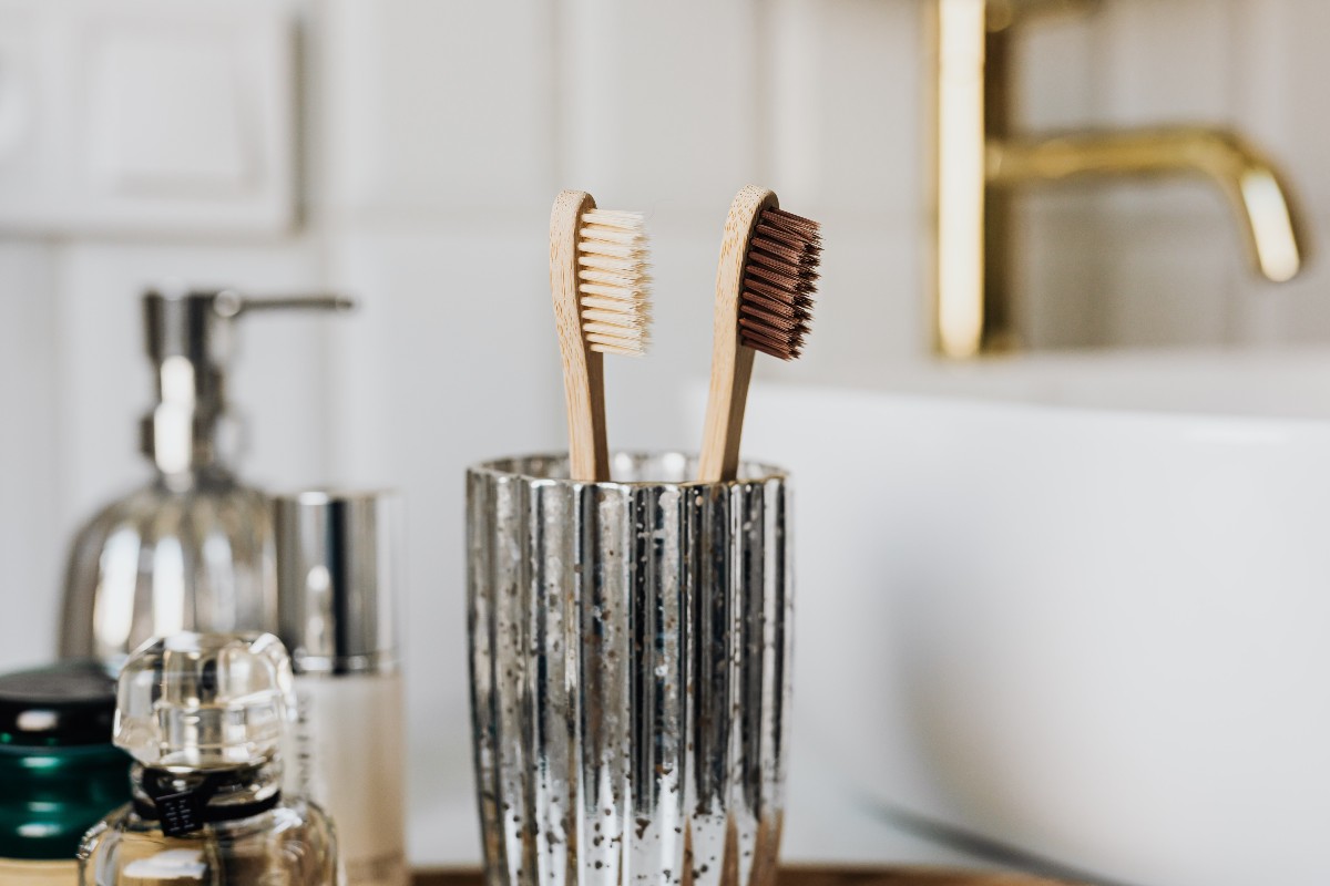 two toothbrushes in a cup